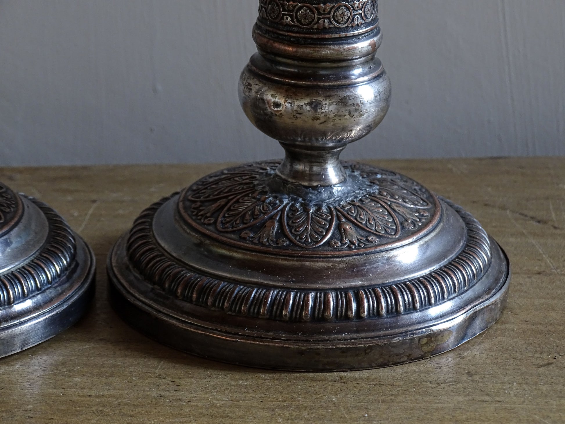 French antique silver plate candlesticks with classical urn motifs and aged patina