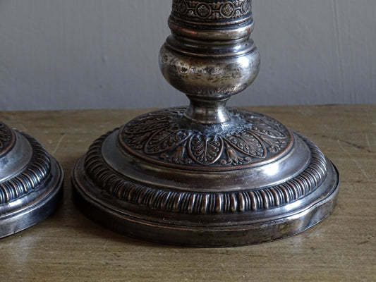 French antique silver plate candlesticks with classical urn motifs and aged patina