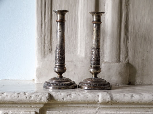 French antique silver plate candlesticks with classical urn motifs and aged patina