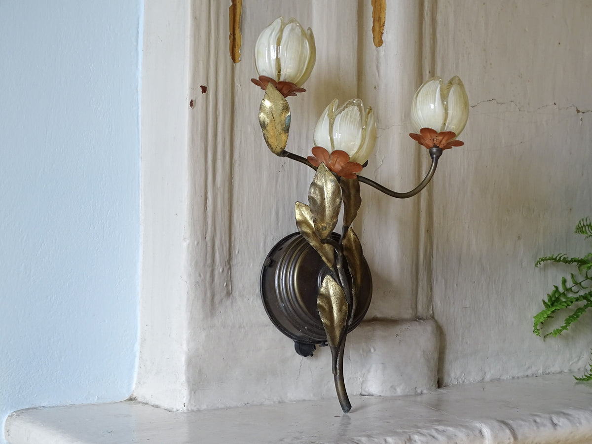 Vintage Murano tulip glass wall light with gilt leaves by L'Originale, displayed on a country house fireplace