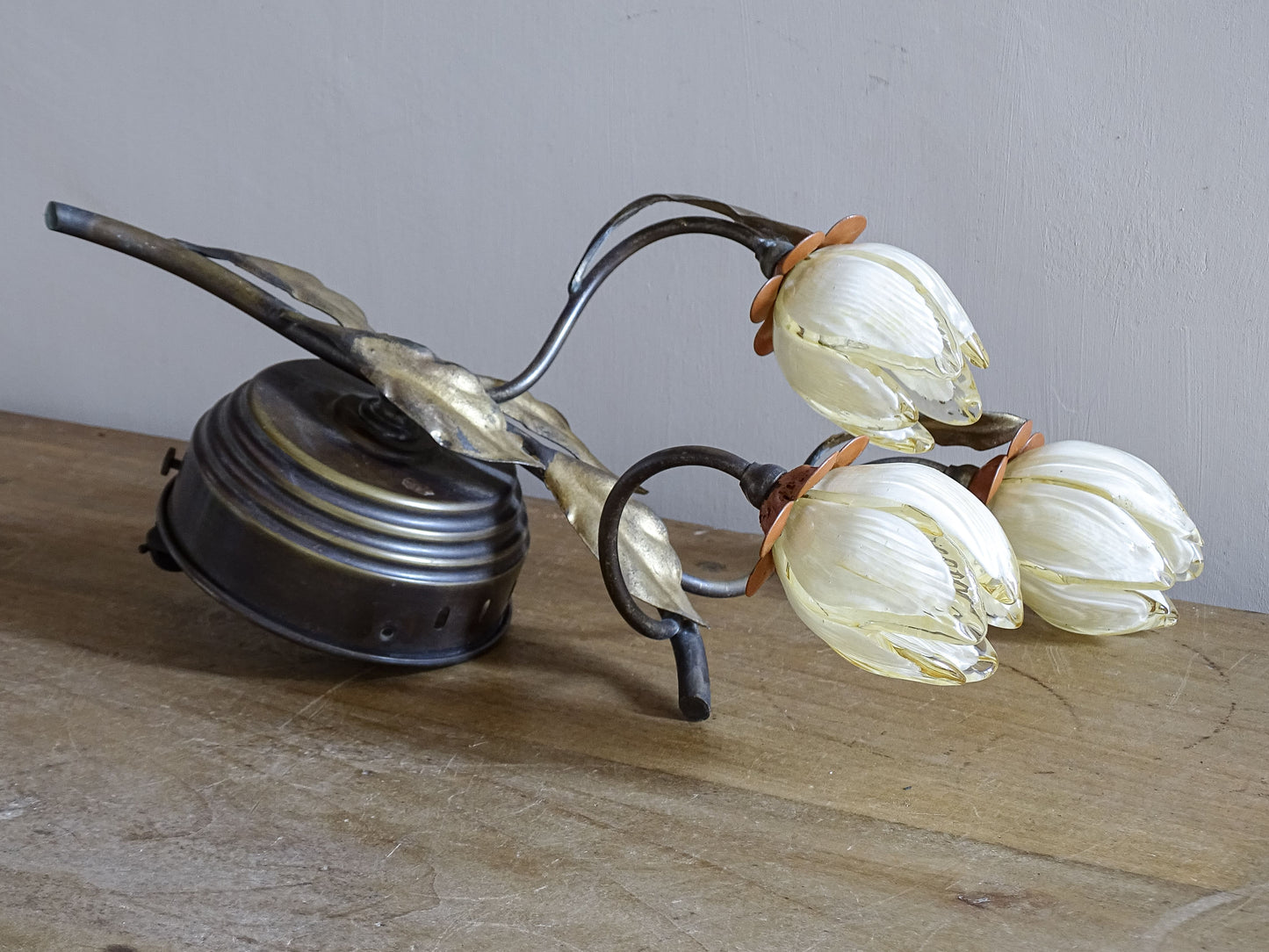 Close-up of Murano glass tulip shade on vintage Italian wall sconce