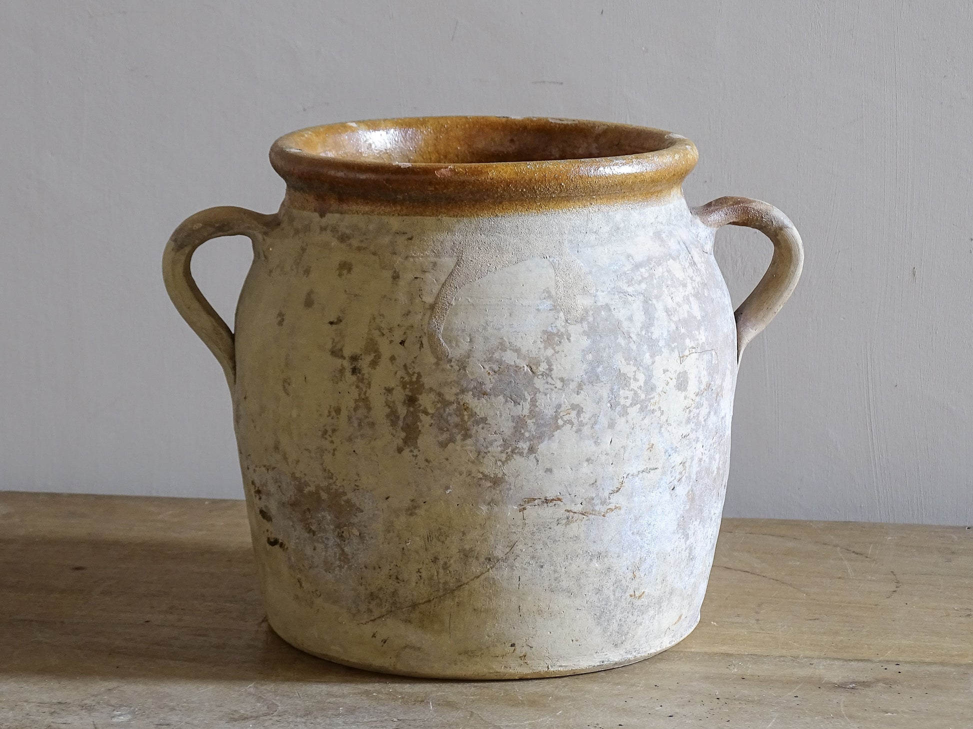 Mid century French ceramic confit pot with aged patina and yellow glaze interior