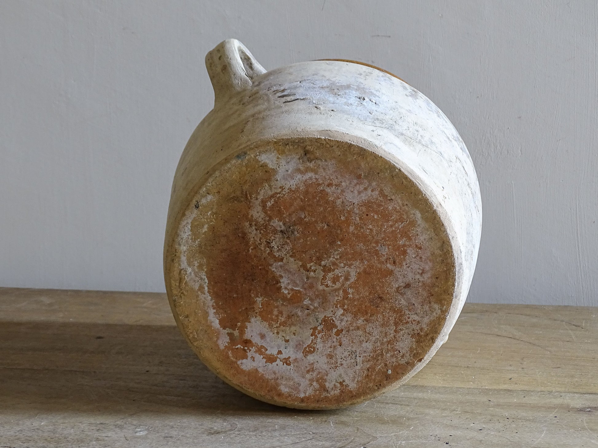 Vintage rustic French pottery vessel with yellow glazed interior and farmhouse character