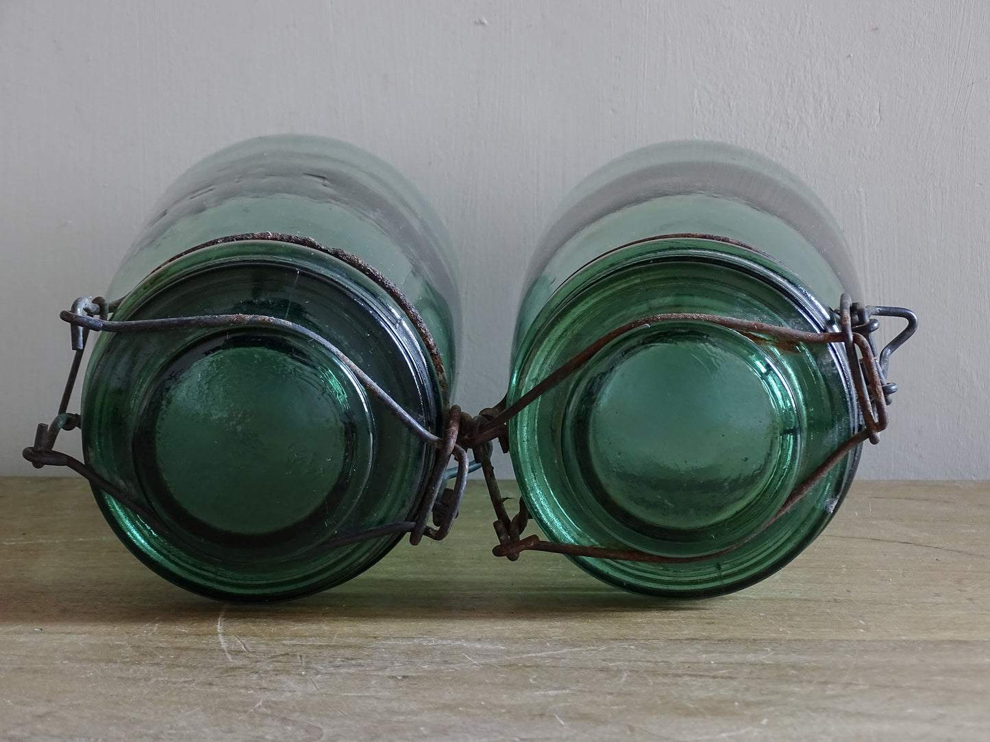 Tall French vintage preserving jars in softly tinted blue green glass