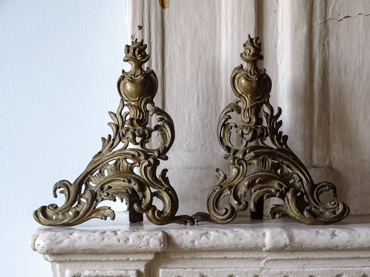 French antique rococo brass andirons or chenets, pictured on a country house fireplace