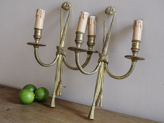 Pair of French vintage gilt metal wall sconces with tassel detail