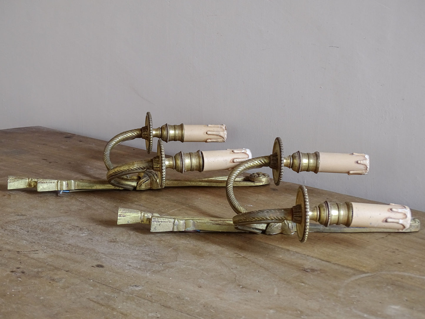 Decorative vintage French wall sconces with twisted arms and tassels