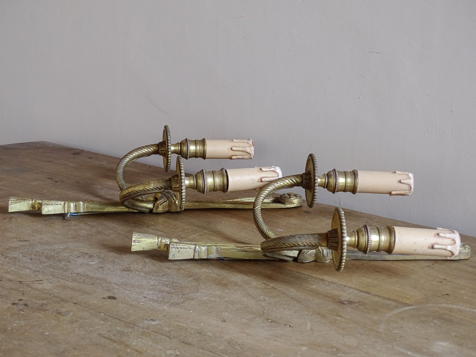 Decorative vintage French wall sconces with twisted arms and tassels