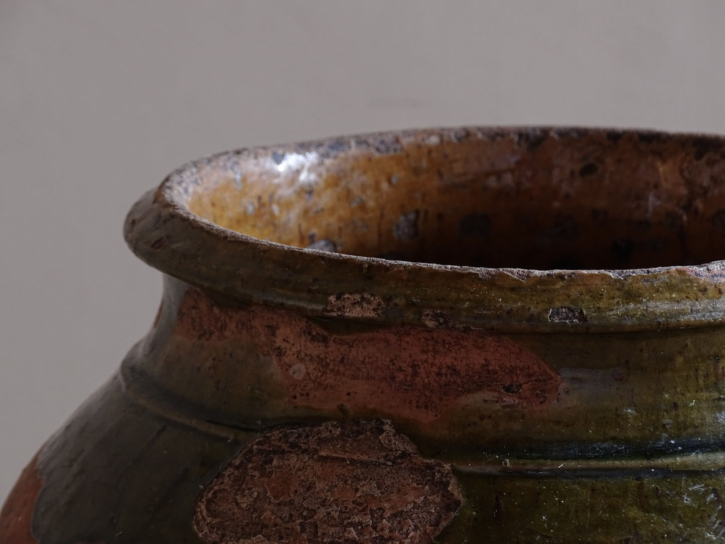 French antique pottery jar with rounded form and mustard yellow glazed interior