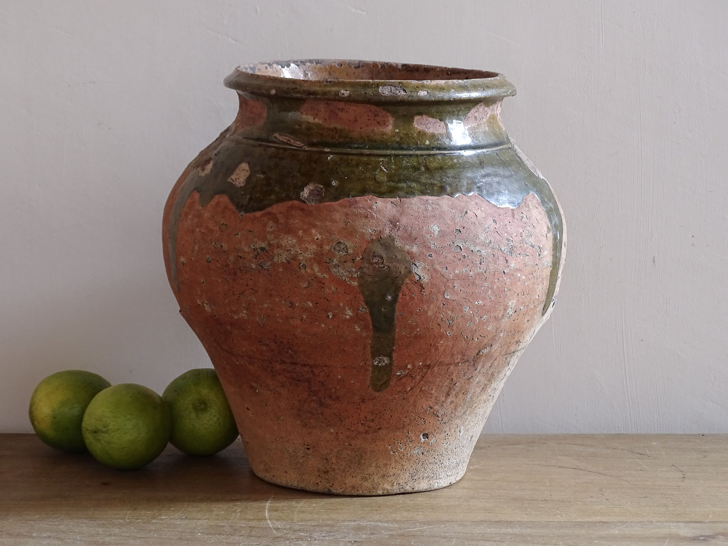 French antique earthenware jar with green glaze and terracotta body dating from c. 1880-1920