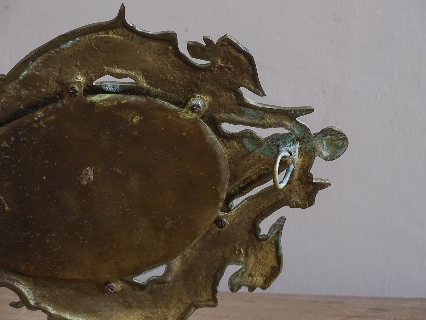 Antique French wall candle holder with mirror, cherub crest and decorative acanthus scrollwork.