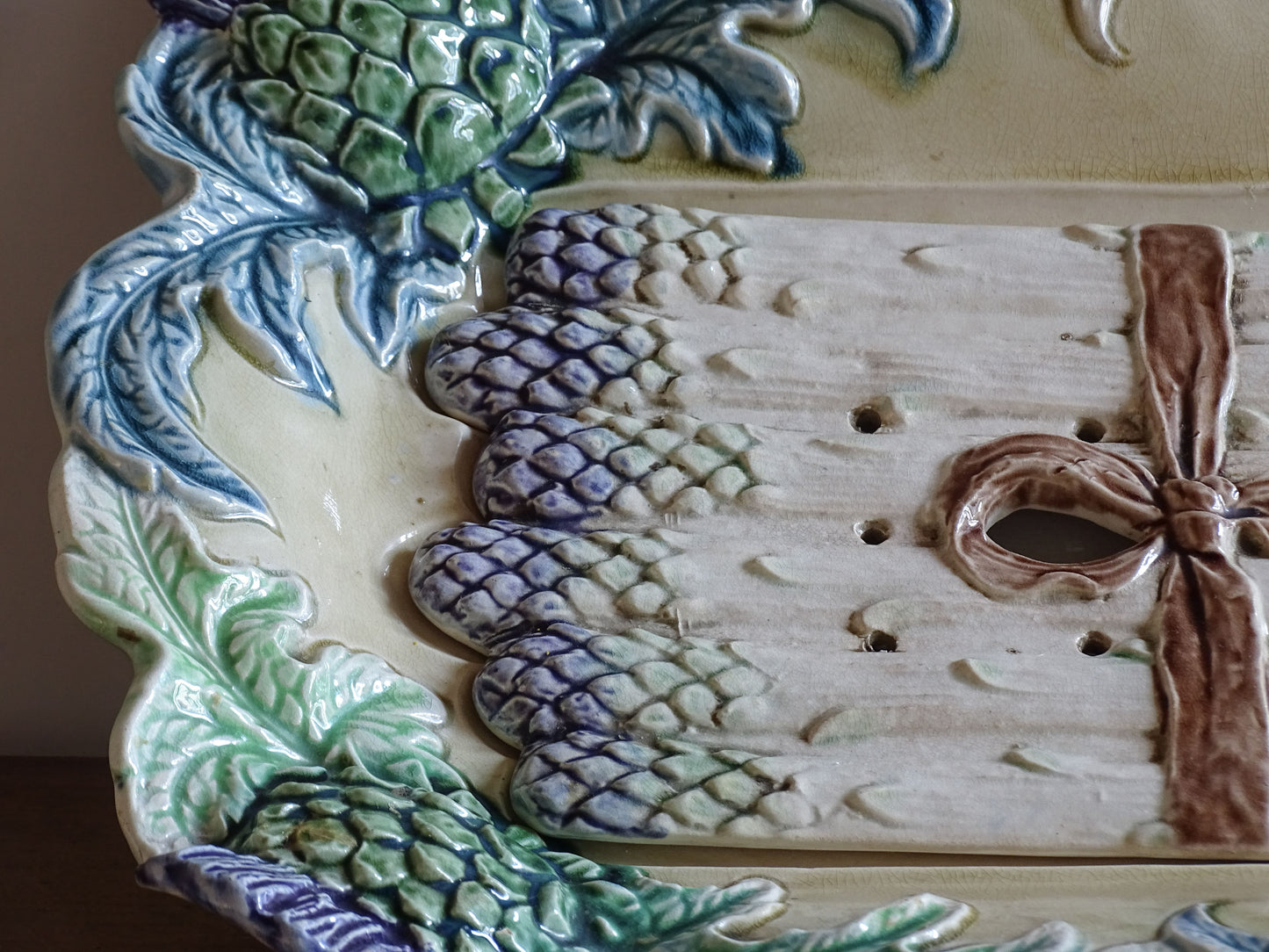 Antique French asparagus serving dish with colourful barbotine artichoke border and removable insert.