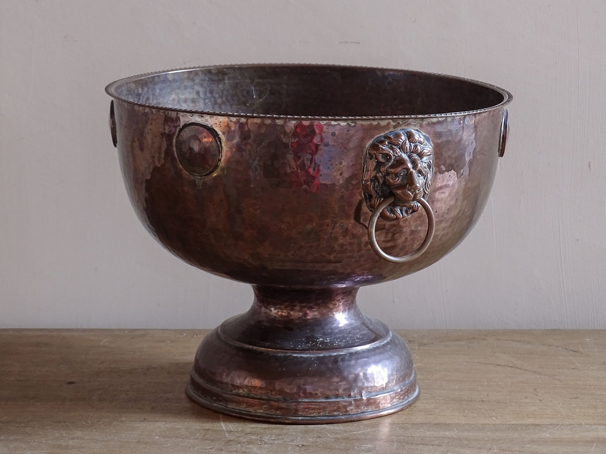 Antique copper wine cooler with hand-hammered finish and aged patina.
