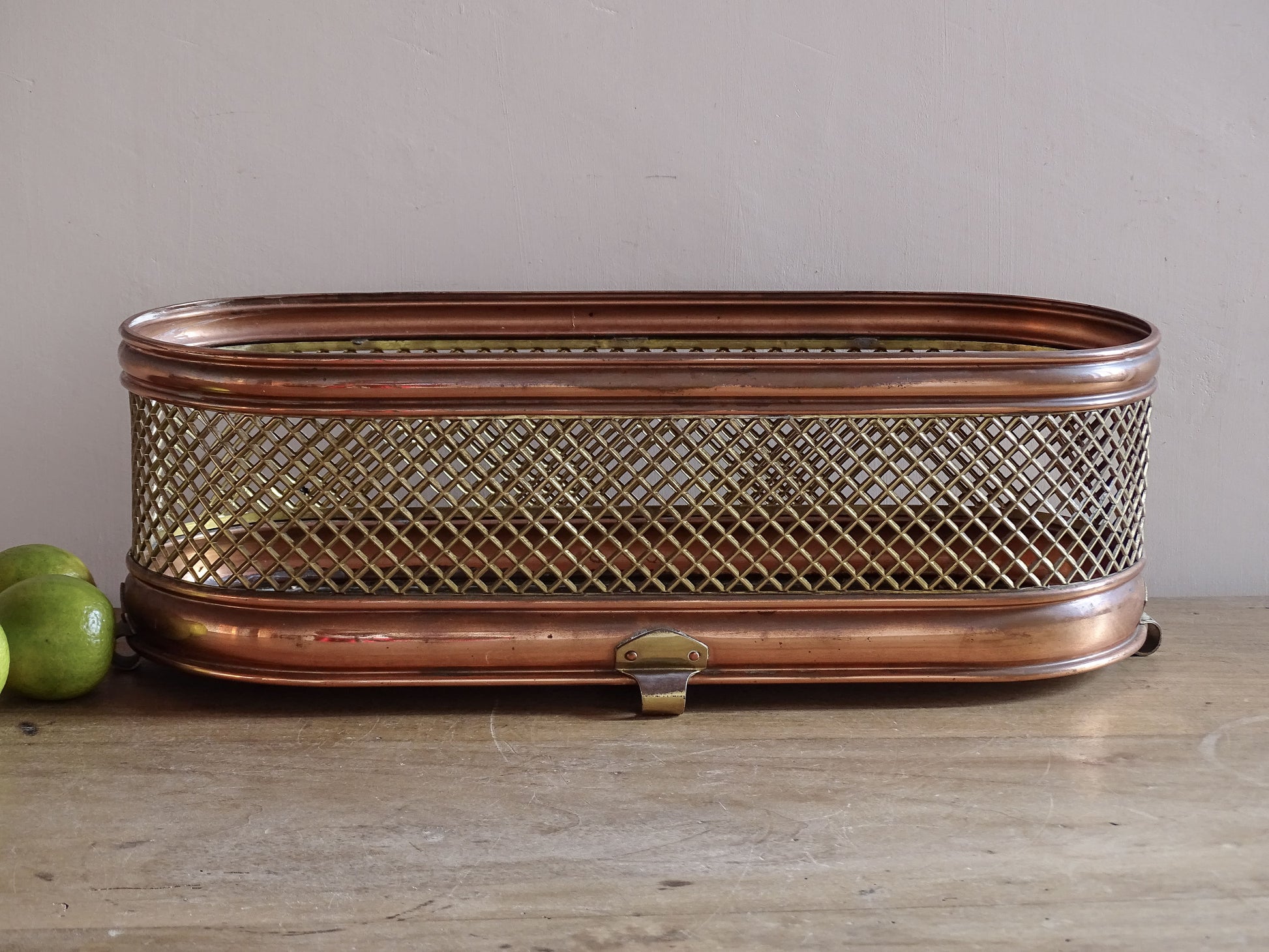 Vintage oval planter with brass lattice sides and aged patina
