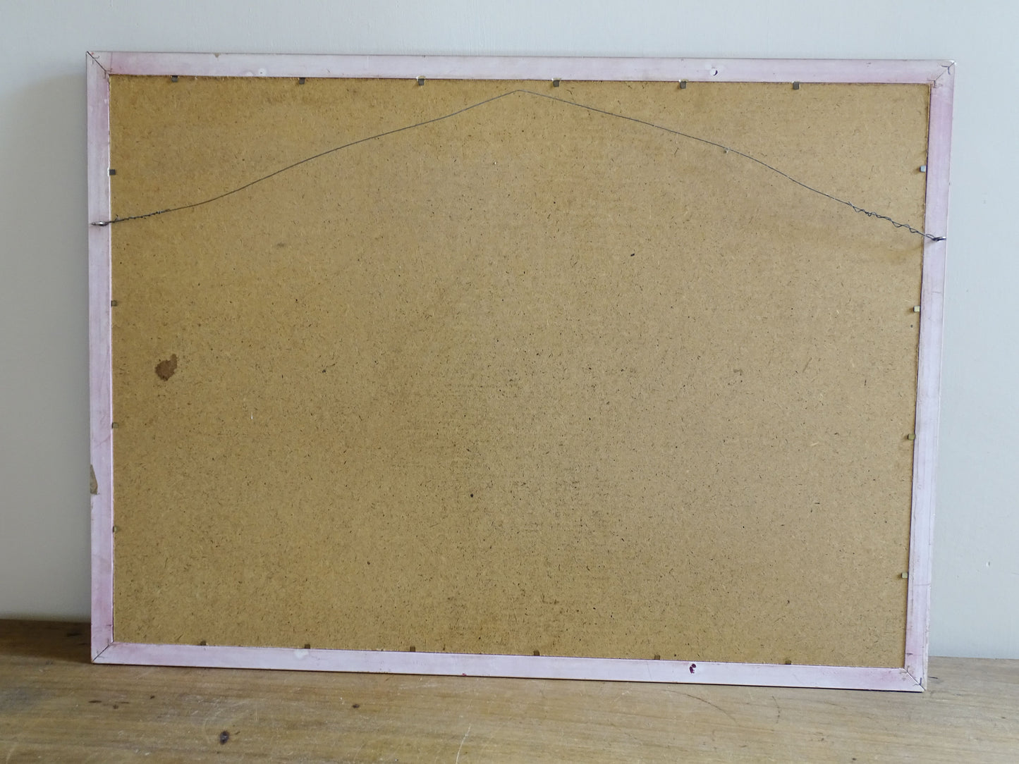 Reverse of framed Louis Neillot lithograph showing hanging wire and backing