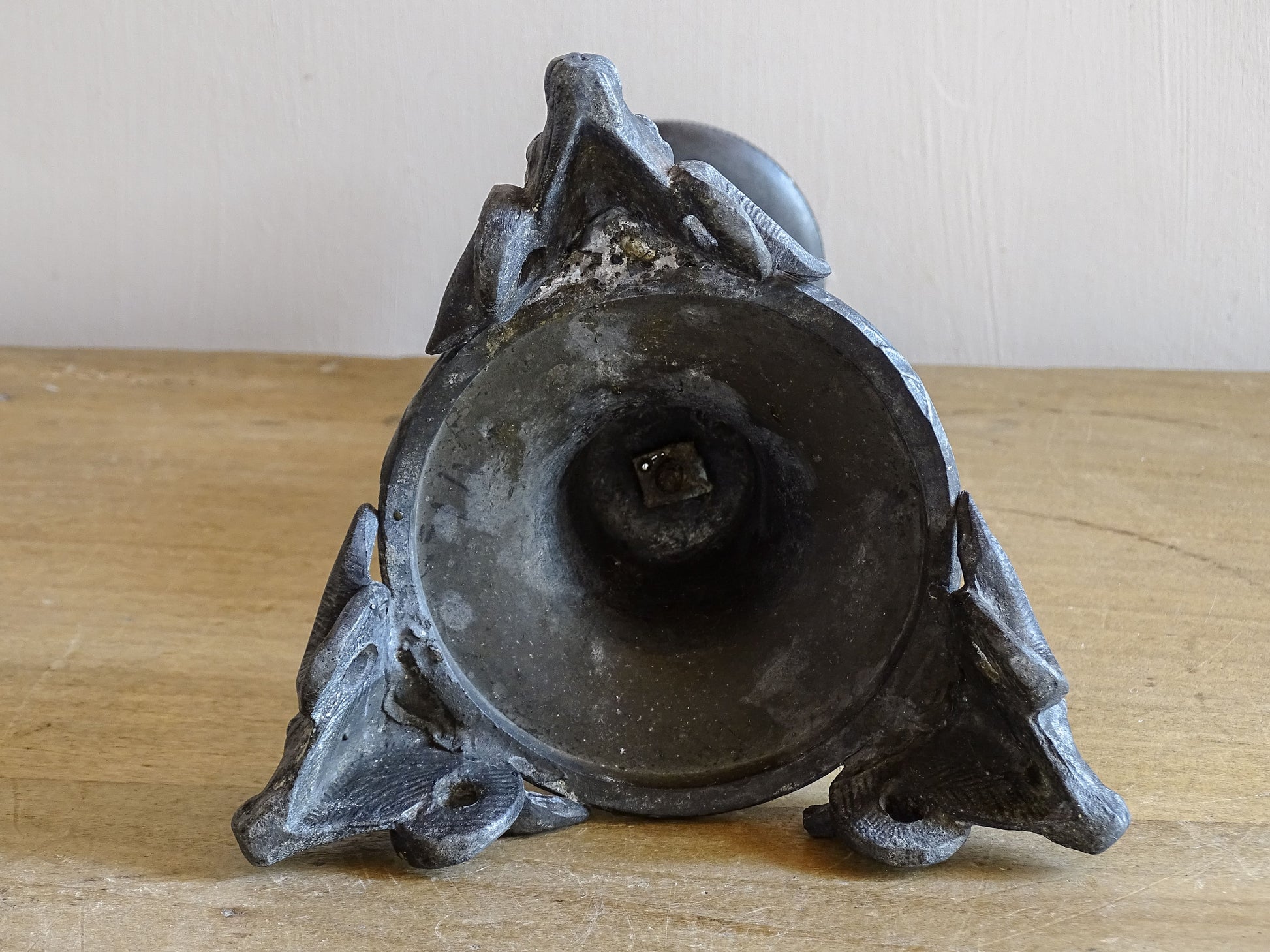 French antique candlestick displayed on wooden table