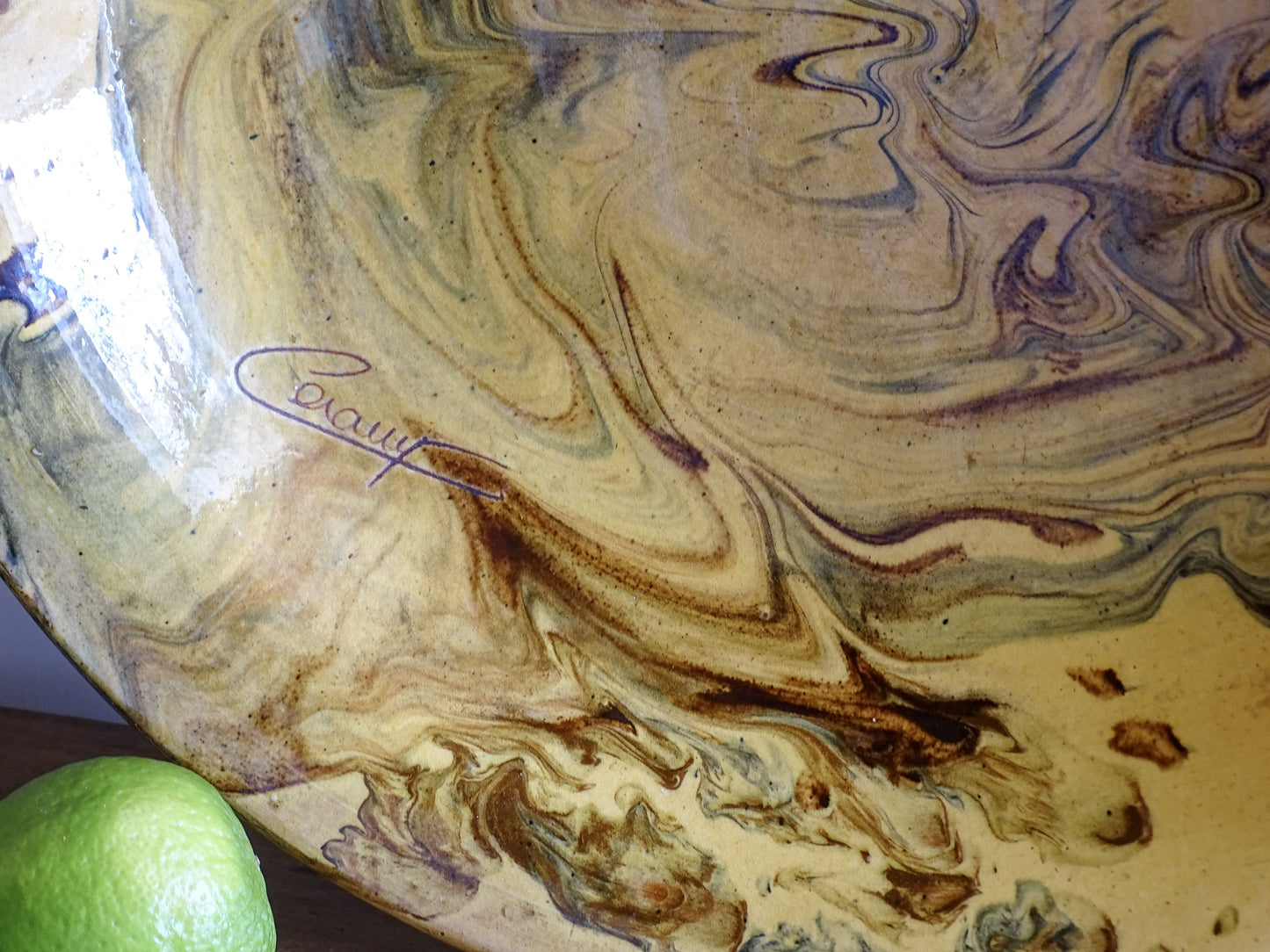 Large jaspe pottery centrepiece bowl in warm ochre and green tones