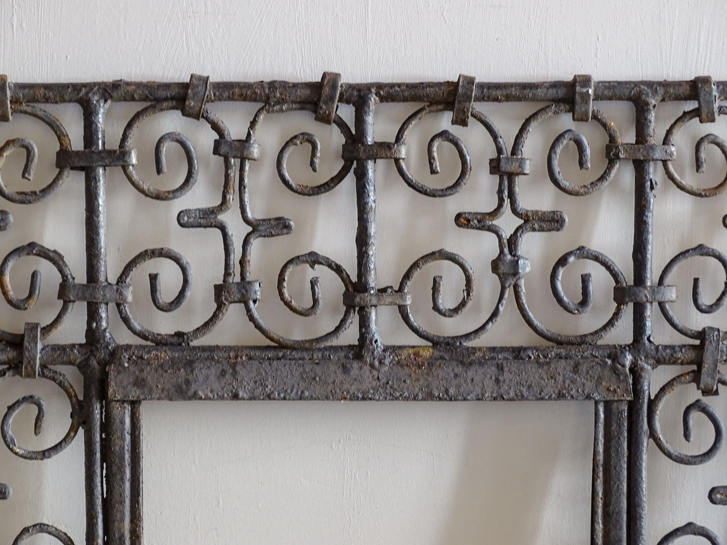 Rustic Moroccan wrought iron wall mirror frame with scroll design