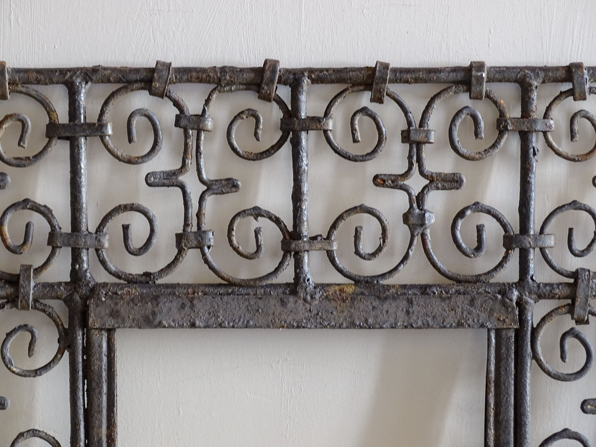Rustic Moroccan wrought iron wall mirror frame with scroll design