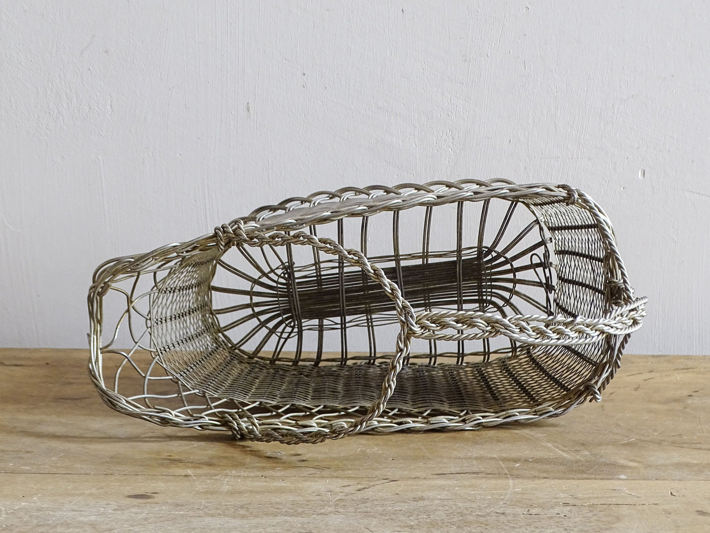 French vintage wire wine bottle carrier with twisted handle.