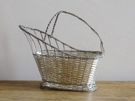 A French vintage silver-tone  woven wire wine basket or bottle carrier. 