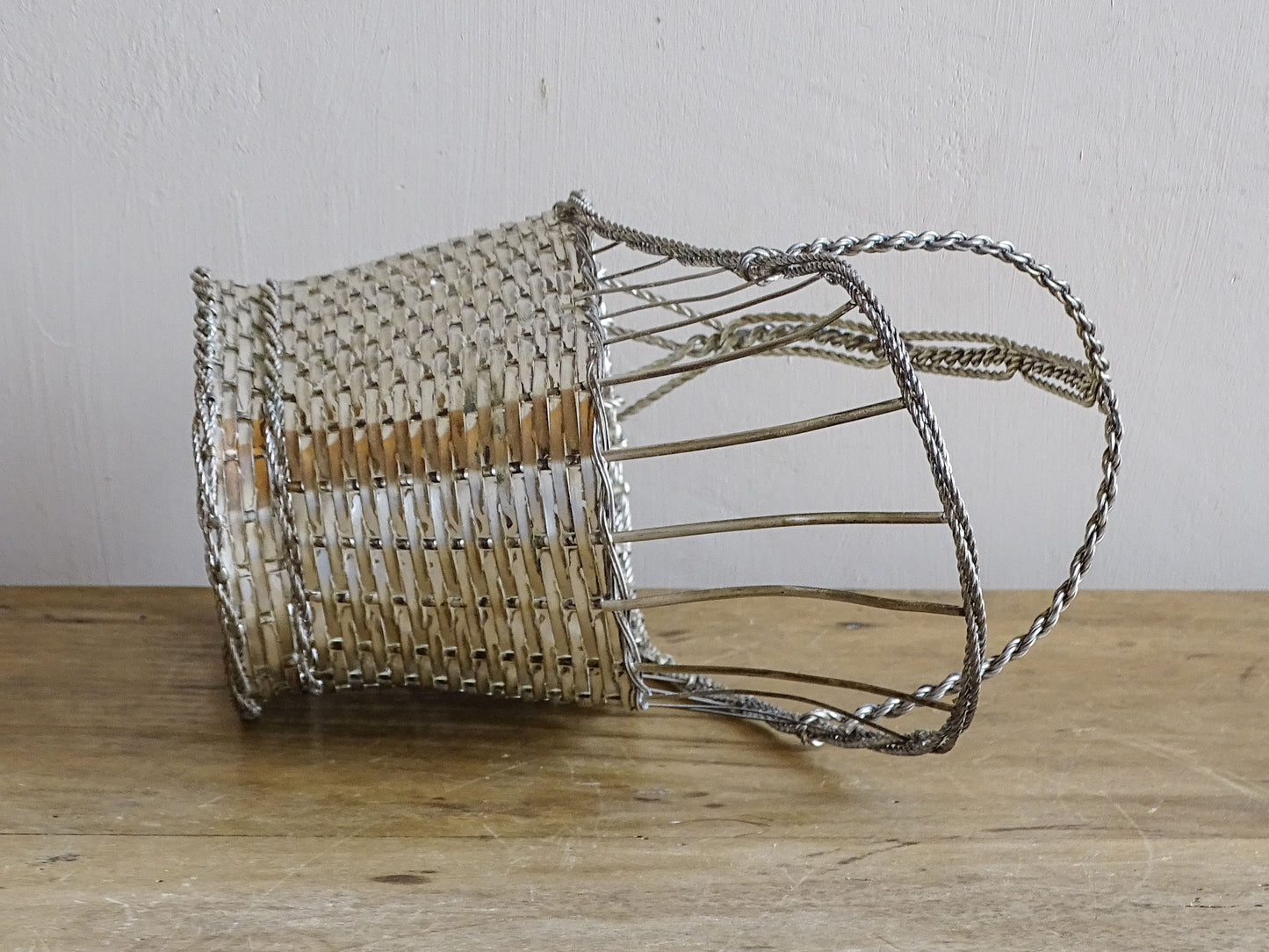 A French vintage silver-tone  woven wire wine basket or bottle carrier. 