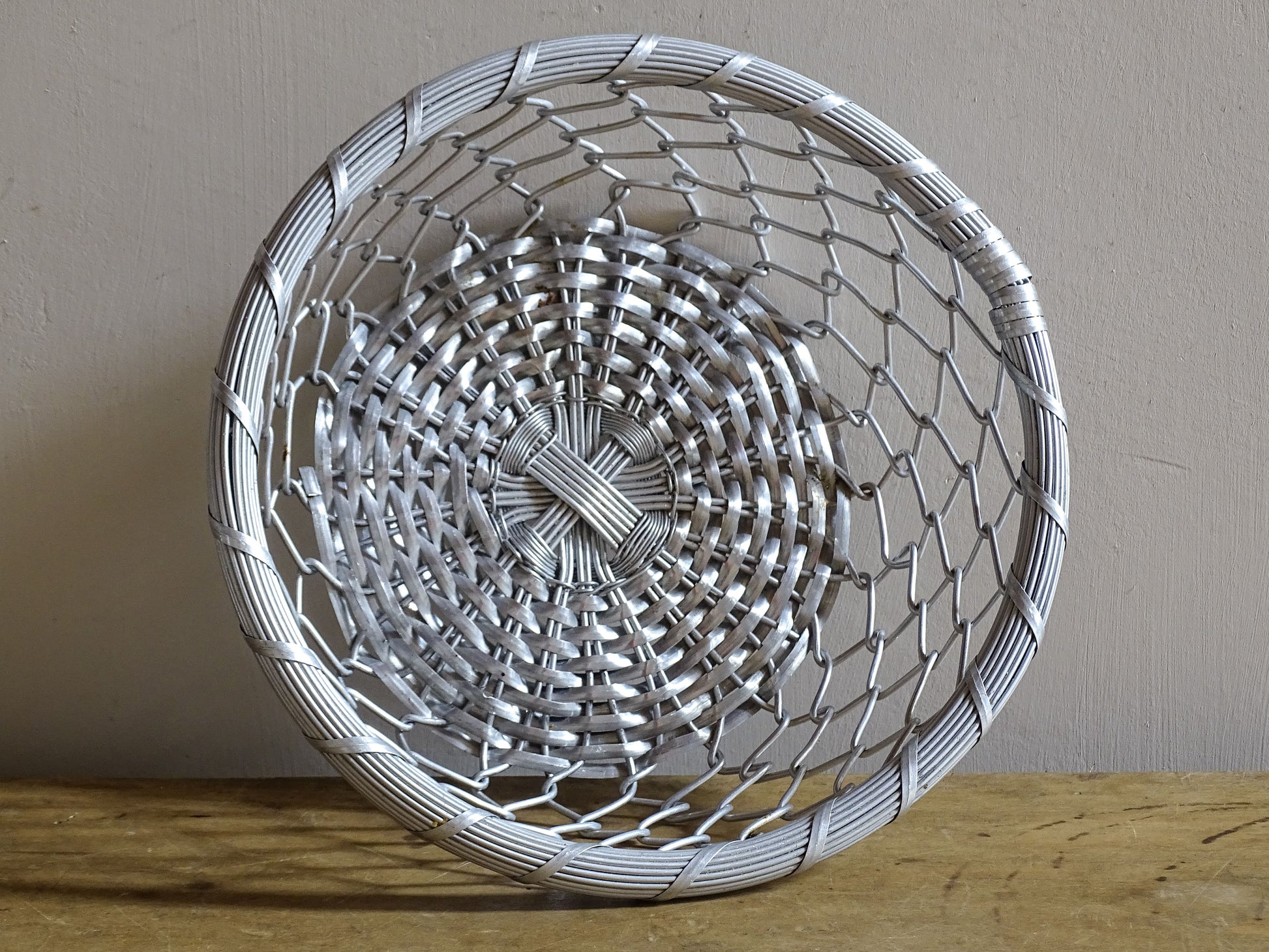 A French vintage silver coloured, round, wire basket. 