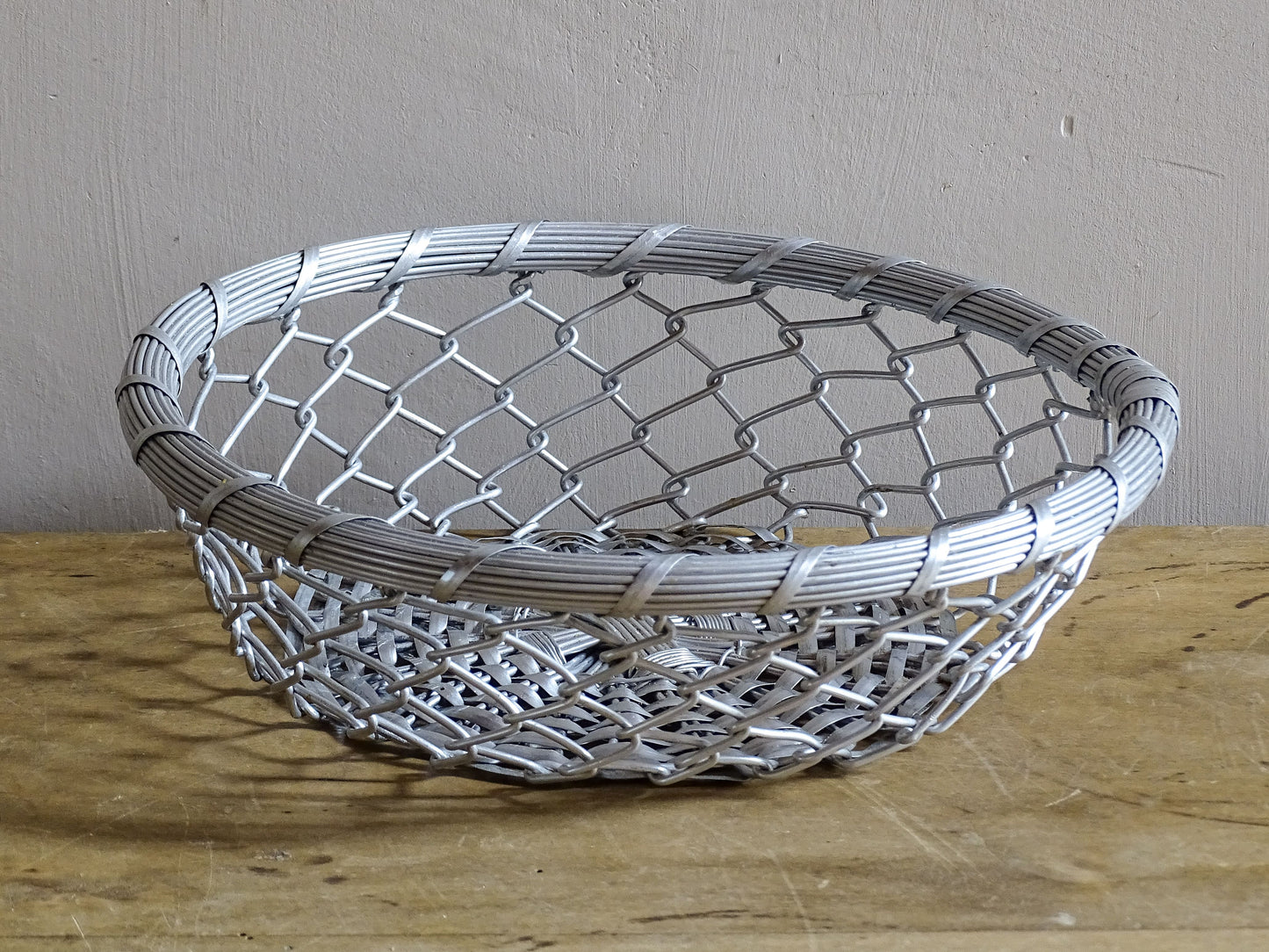 A French vintage silver coloured, round, wire basket. 
