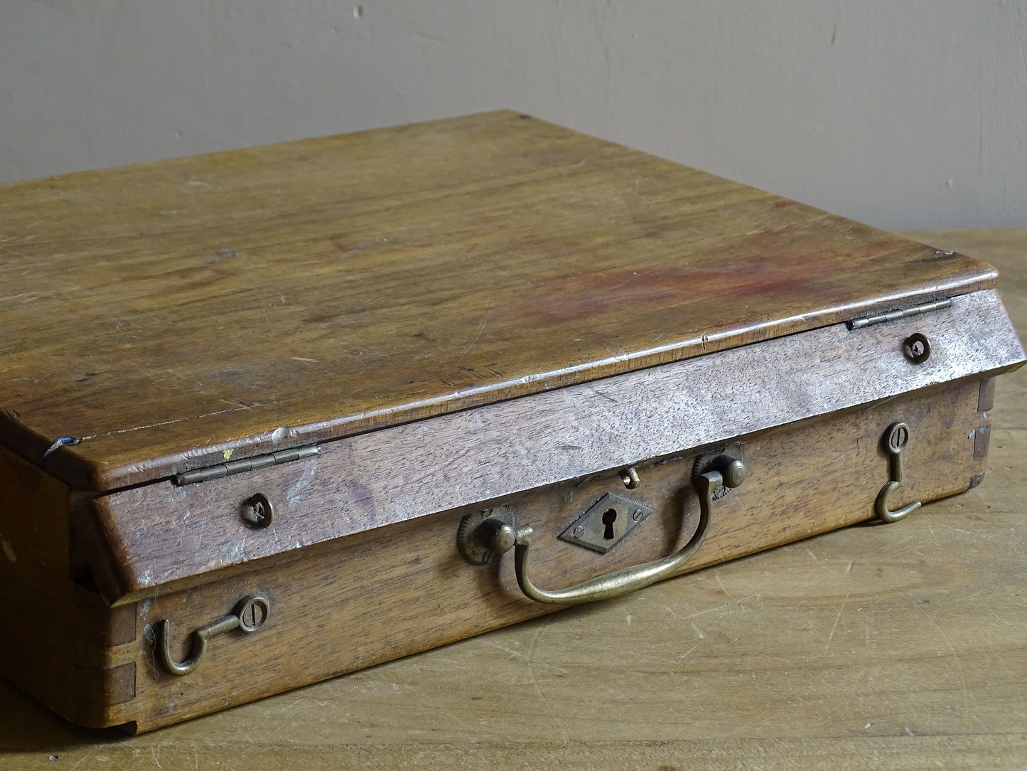 Wooden French painter’s box with dovetail joints, brass handle and art materials