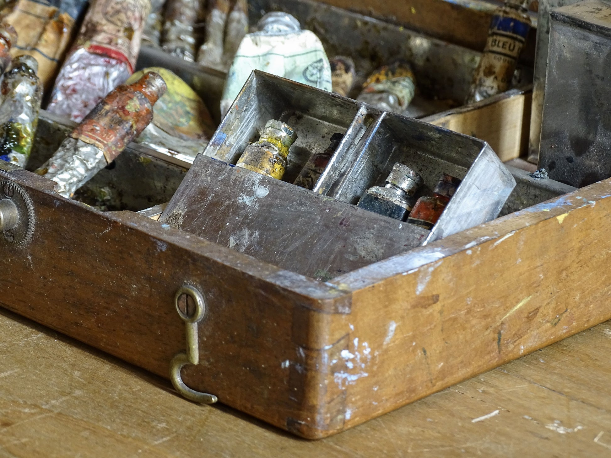 Early 20th-century artist’s box with wooden palette and well-used oil painting materials