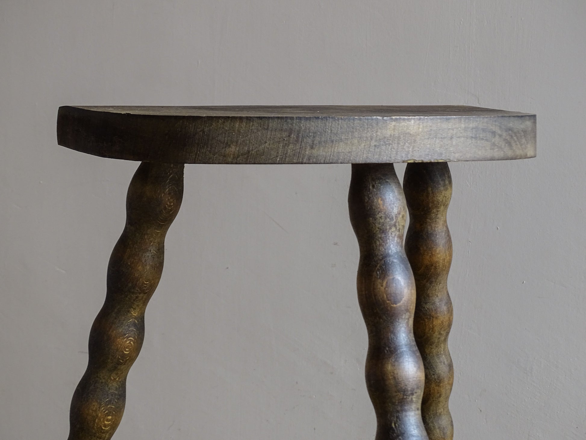 Small wooden side stool with a demi-lune shaped seat