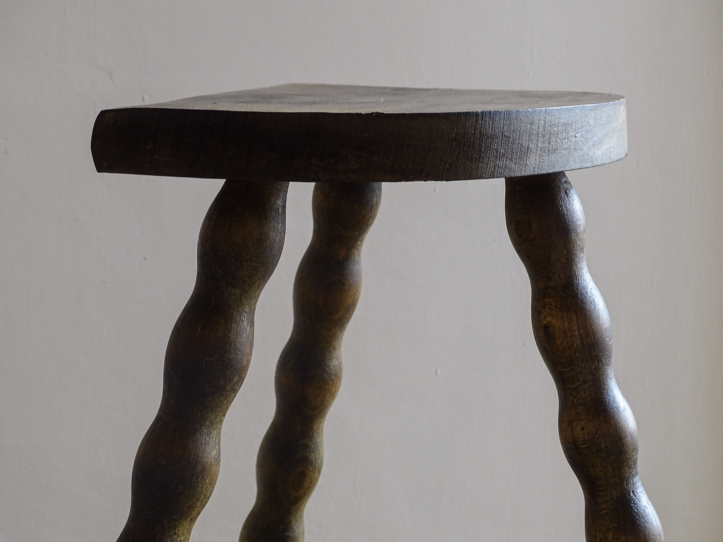 Rustic vintage stool suitable as a side table or plant stand