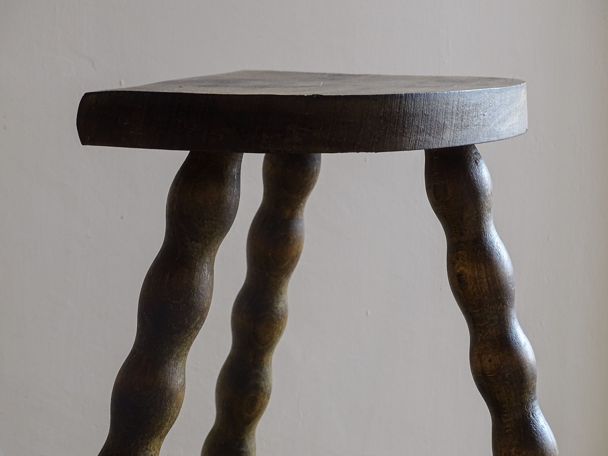 Rustic vintage stool suitable as a side table or plant stand