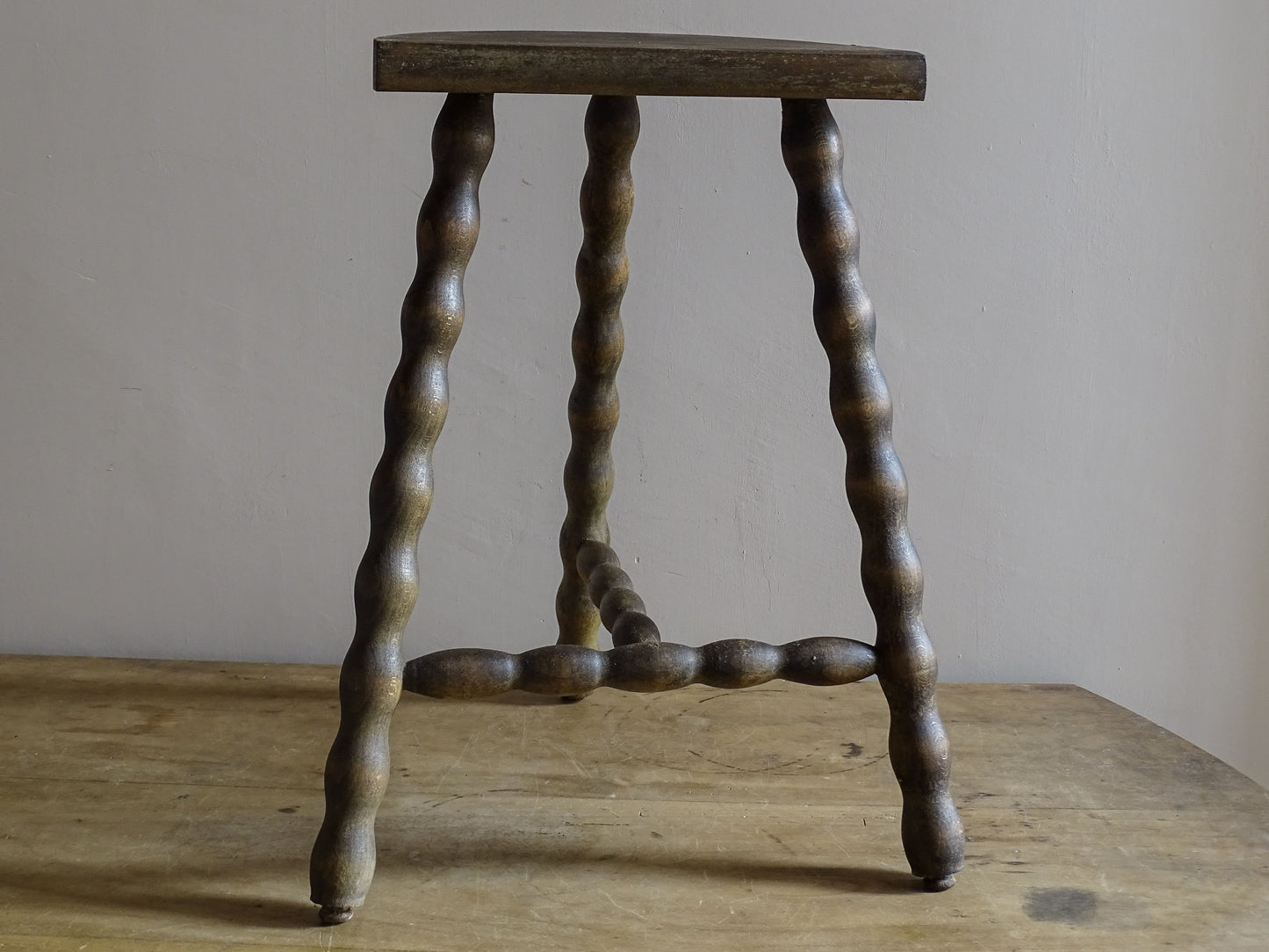 French wooden accent stool with sculptural bobbin detailing