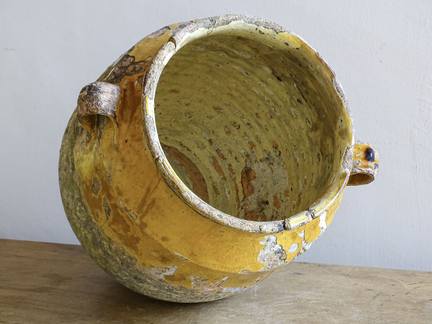 worn glaze and earthenware surface on French confit pot