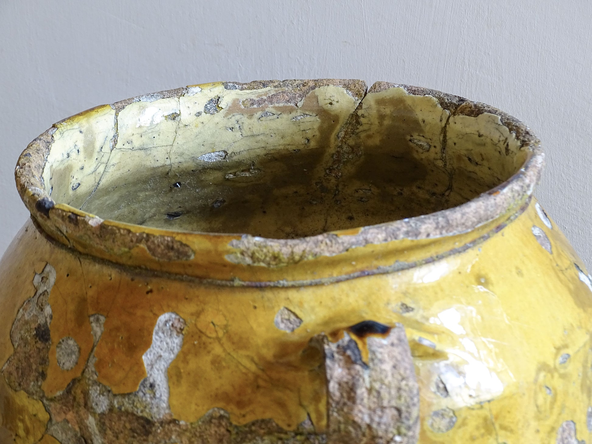 Large antique French yellow glazed confit pot with textured earthenware body