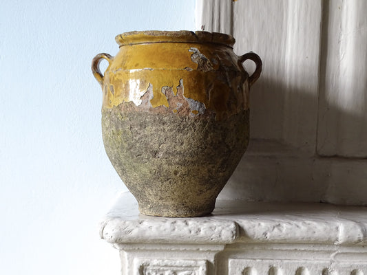 French antique confit pot with mustard yellow glaze with a rustic timeworn appearance