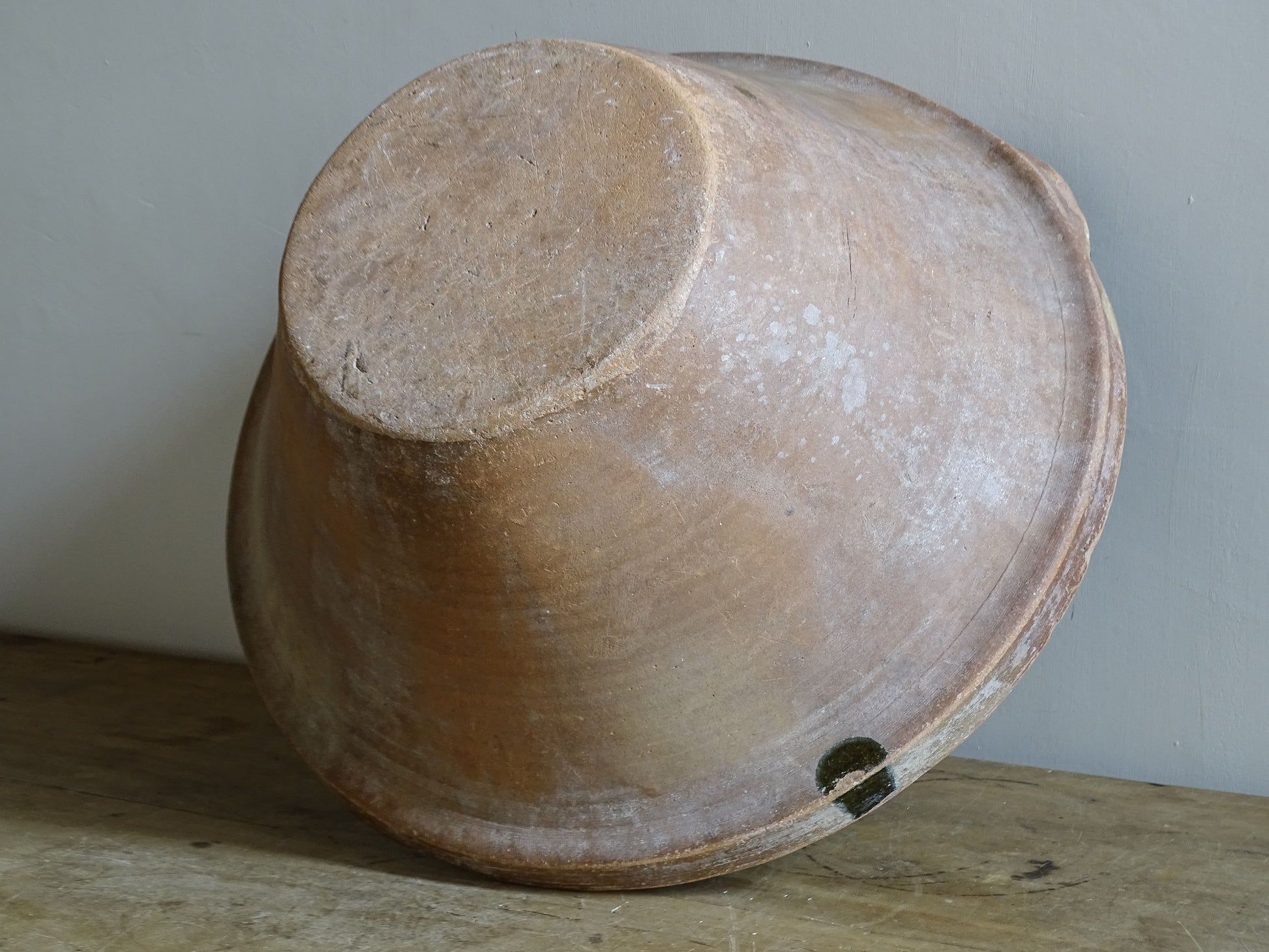 Large antique French tian bowl with dark olive-green glazed interior and unglazed terracotta exterior, early 20th century.