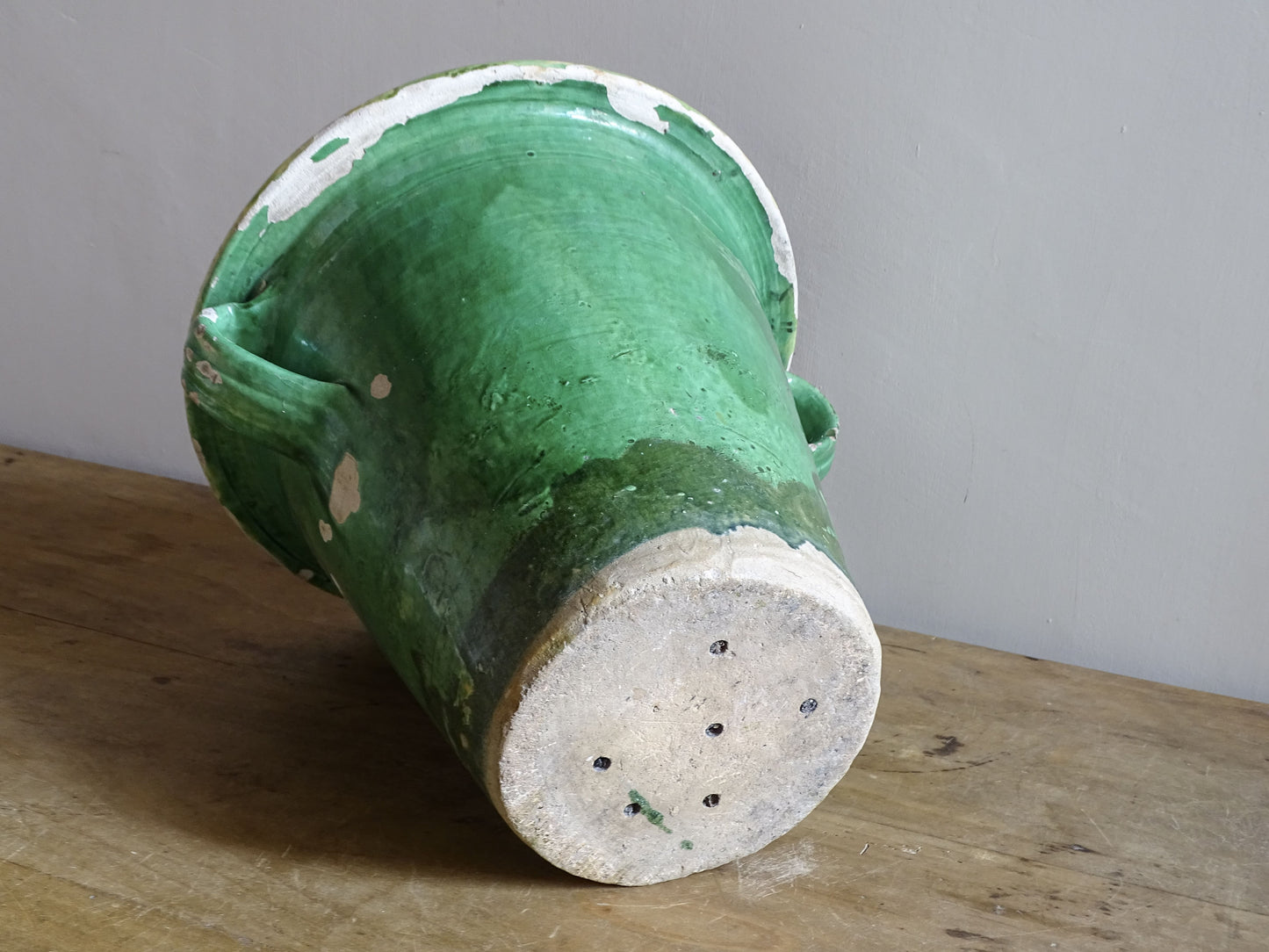 Antique French earthenware planter with green exterior and yellow interior