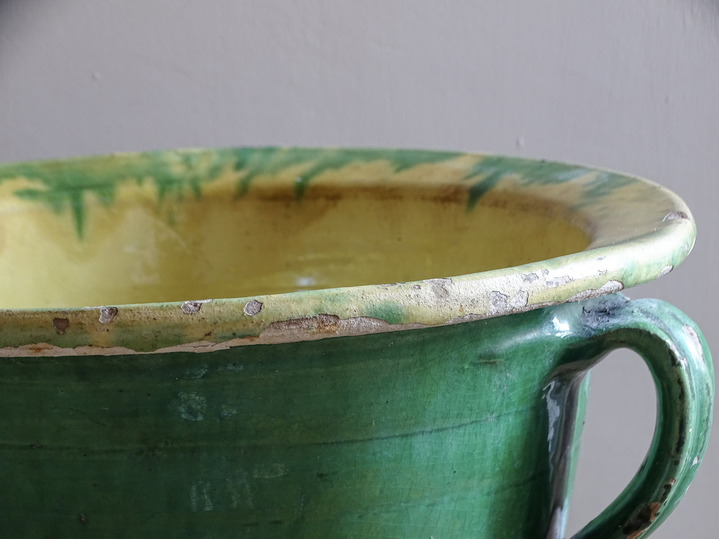 Large green glazed earthenware planter with broad flared rim