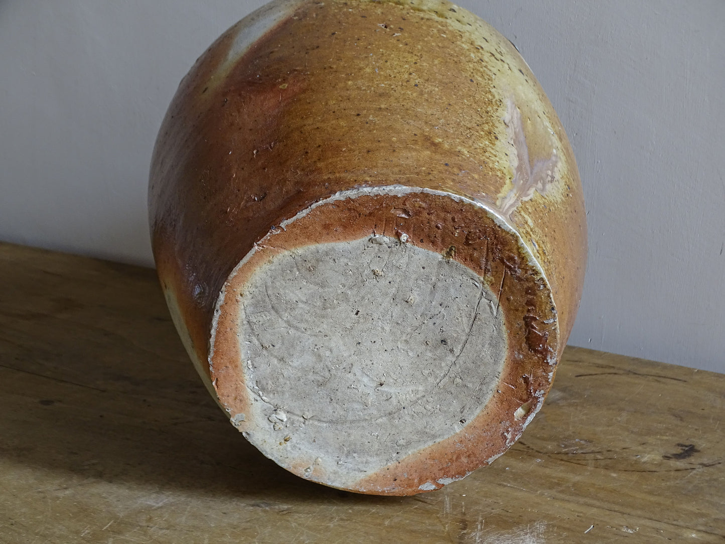 Large pottery jug with warm brown ochre and reddish glaze