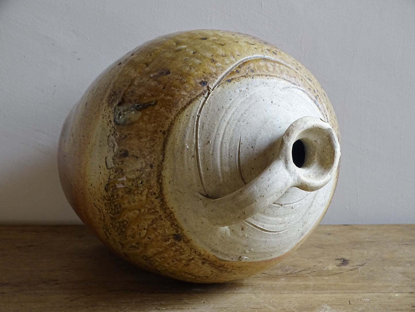 Hand-thrown stoneware jug with irregular mottled glaze