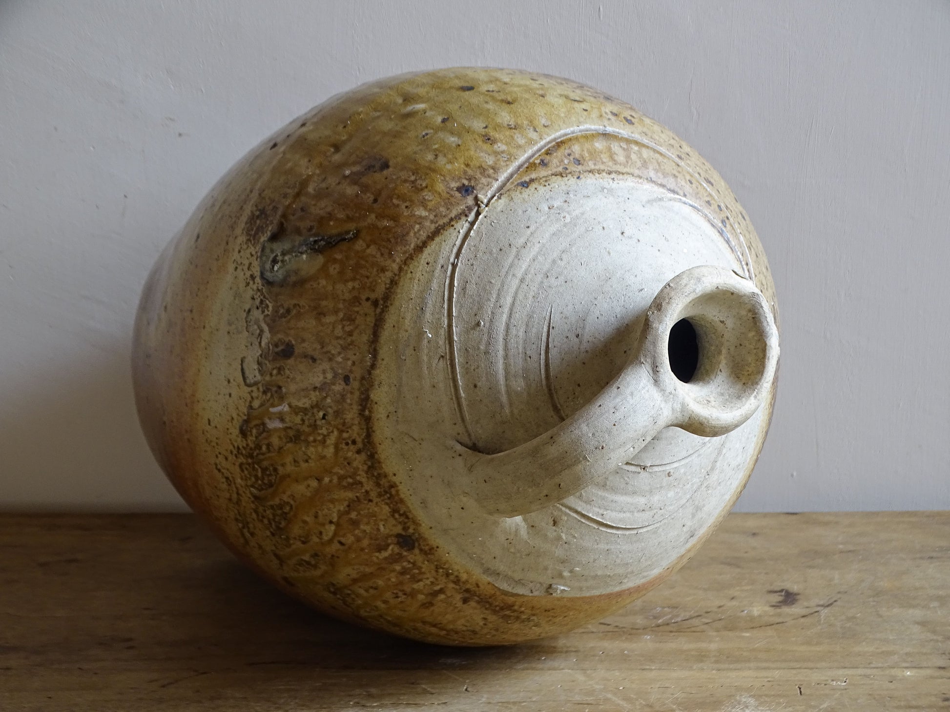 Hand-thrown stoneware jug with irregular mottled glaze