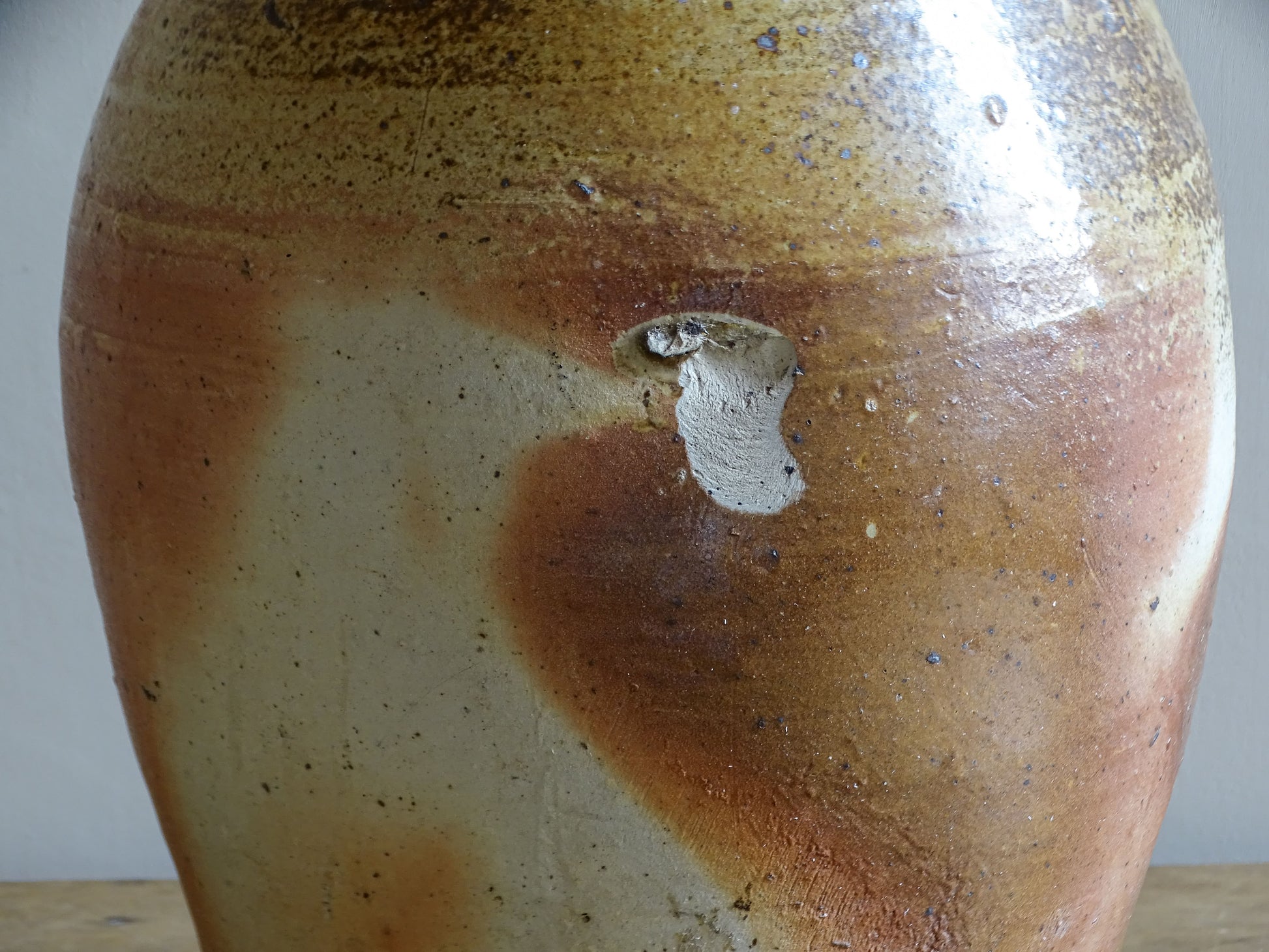 Antique French cruche with pale neck and warm glazed body