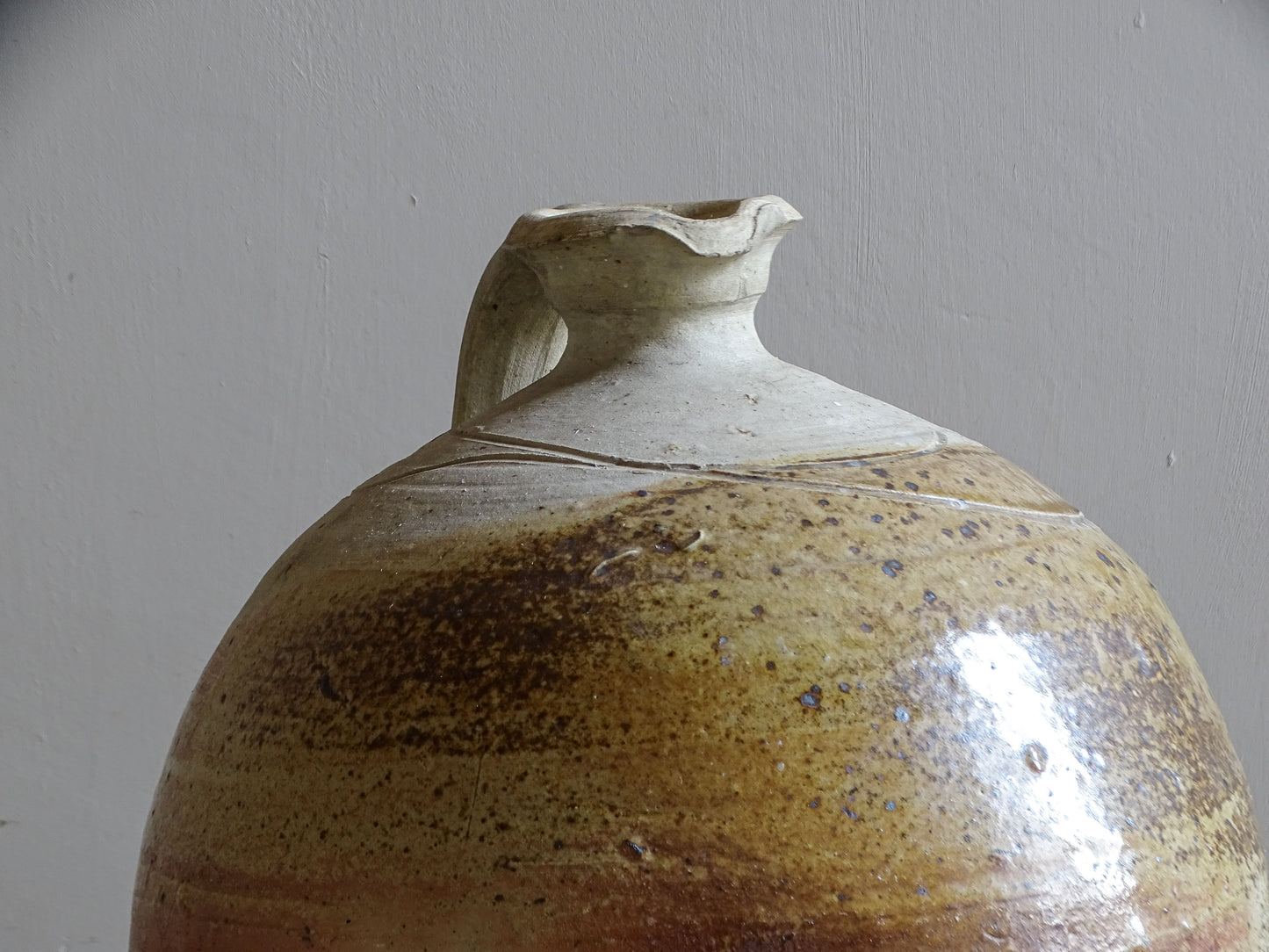 Large rustic ceramic jug with applied handle and pouring lip
