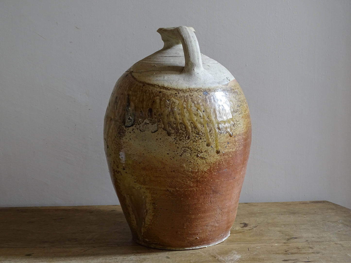 Glazed stoneware vessel with ochre brown and russet tones