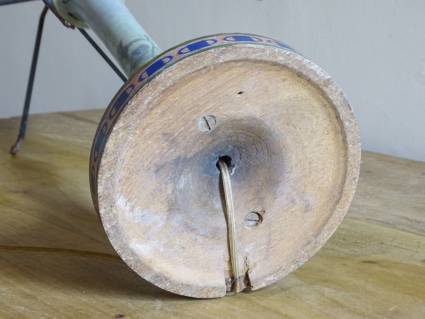 Underside of antique French painted wood lamp showing turned wooden construction