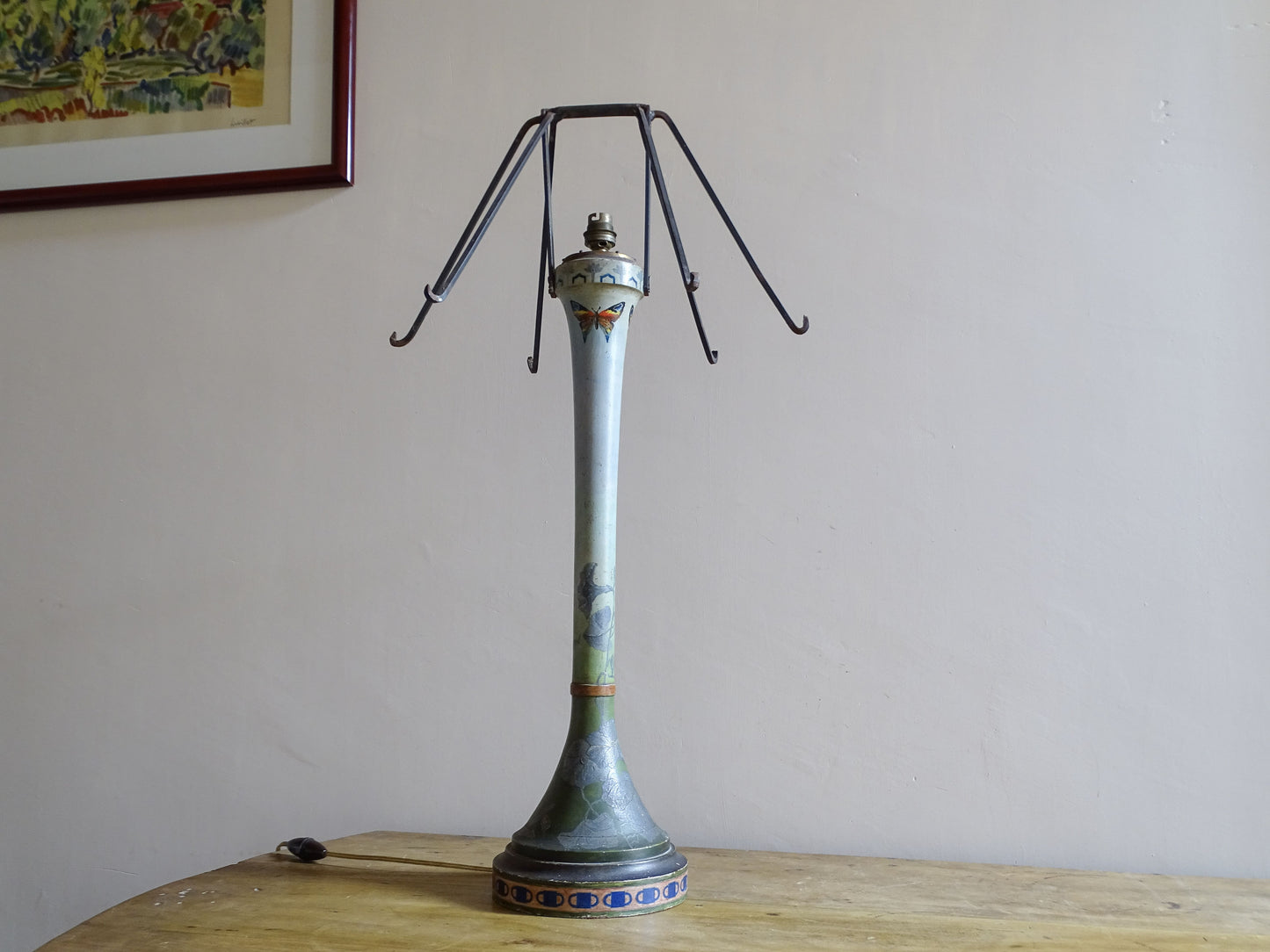 Early 20th century French painted wooden lamp with original iron shade frame
