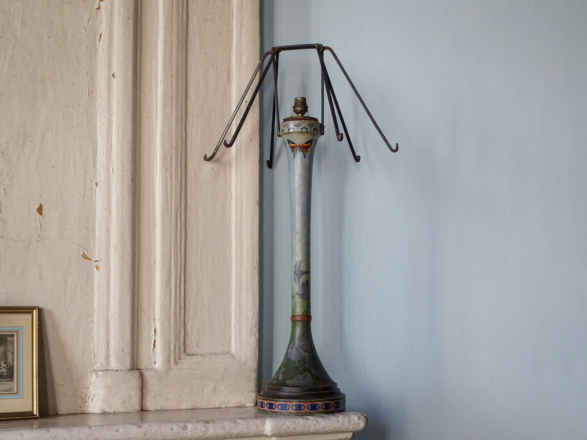 Early 20th century French painted wooden lamp with original iron shade frame on fireplace