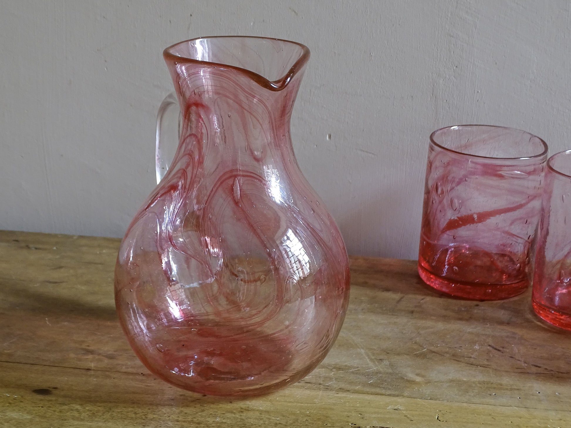 Vintage pink glass water pitcher and six tumblers